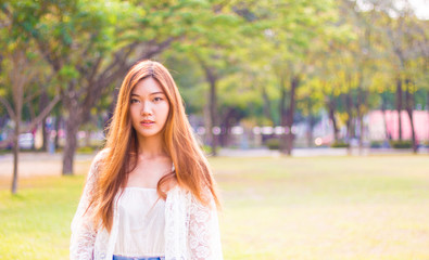 Portrait of a beautiful young Asian woman outdoor