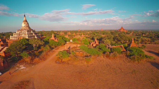 Flying over Shwesandaw Pagoda and Temples in Bagan at evening, Myanmar (Burma), 4k
