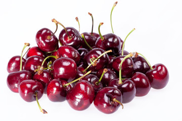 some of ripe red cherry isolated on white background