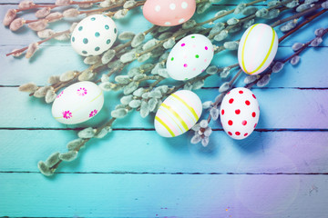 Easter concept with colored eggs on wooden background