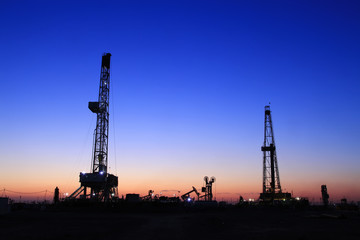 The silhouette of oilfield derrick