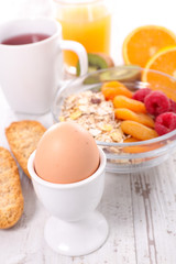 breakfast with egg,cereal and tea