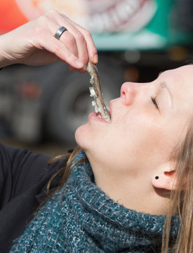 Dutch Woman Is Eating Typical Raw Herring