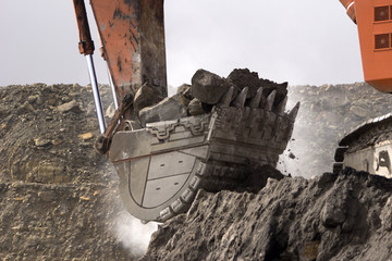 excavating rock at a coal mine, West Coast, New Zealand