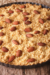 Italian Pie Sbrisolona macro in the baking dish. Vertical

