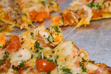 Pizza with tomato cheese and prawn.
