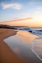 Fototapeta premium Beautiful sand beach near El Cotillo village on Fuerteventura island on the sunset in Spain