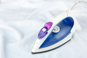 Flatiron lies on white fabric on white isolated background