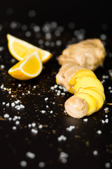 Fototapeta na wymiar ginger root with lemon background
