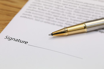contract paper with pen