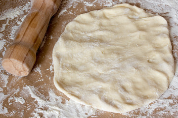 Dough on table with flour.