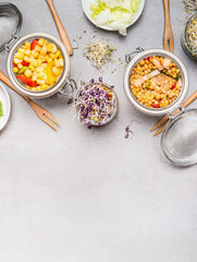 Healthy vegetables jar salad for lunch or picnic  on light stone background, top view, place for text. Clean eating, vegetarian or diet food concept.