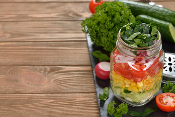 Fresh vegetable salad in Mason jar