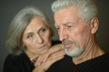Mature couple near wall