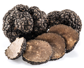 Black truffles isolated on a white background.