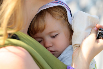 Baby boy on hands of mother