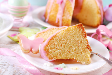 partly sliced easter ring cake with pink icing