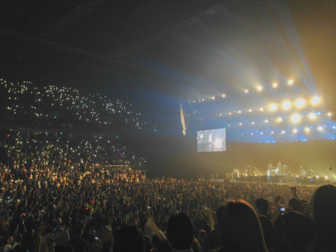 Blurred background : Bokeh lighting in indoor concert with cheering audience