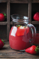 Sweet fresh strawberry juice on the vintage table