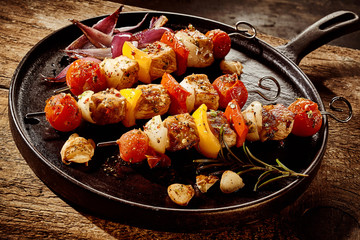 Frying pan filled with kebabs