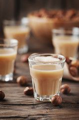 Italian traditional hazelnut liqueur on the wooden table