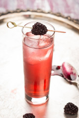 Blackberry cocktail on the metal tray