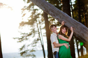 Young couple in love outdoor.Stunning sensual outdoor portrait of young stylish fashion couple posing in summer in field