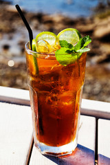 cola cocktail with lemon and mint