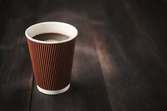 paper cup of hot coffee