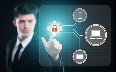 businessman pressing button on virtual screens