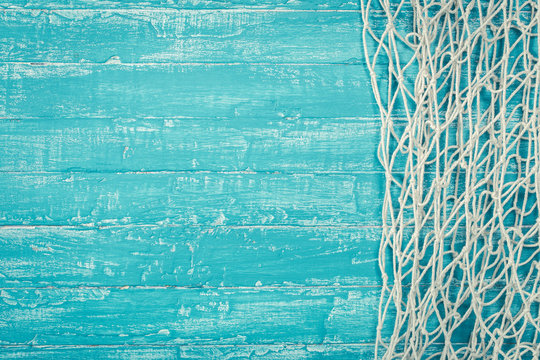 Fishing net from right side of turquoise board