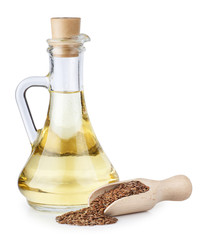 Linseed oil in glass bottle and flax seeds