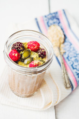 Oatmeal chocolate mousse with berries and pumpkin seeds,top view