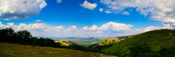 Panorama from  green summer hills.
