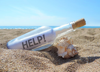 Message in a bottle, washed ashore the beach 