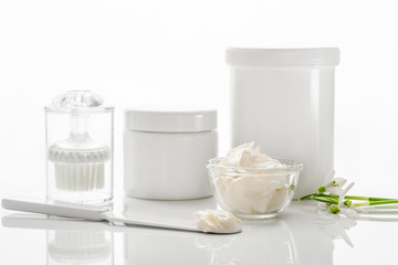 set of cosmetic bottles and face masks isolated on a white backg