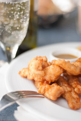 Fresh fried chicken fingers in a plate