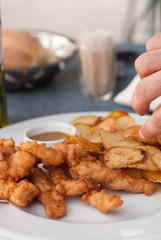 Fresh fried chicken fingers in a plate