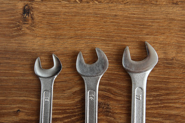 set of mechanical hand tools on wooden background