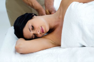 Fototapeta na wymiar Pregnant woman receiving a back massage from masseur