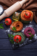 Uncooked color pasta tagliatelle