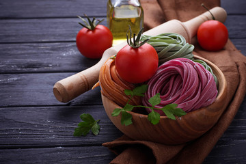 Uncooked color pasta tagliatelle
