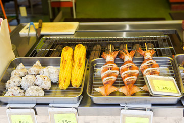 Japanese tasty street and fast food: grilled fish and corn