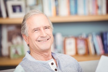 Close-up of senior man smiling at home
