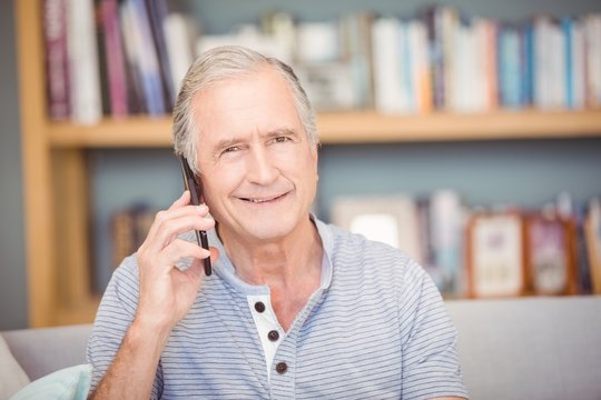 Portrait of senior man using mobile phone