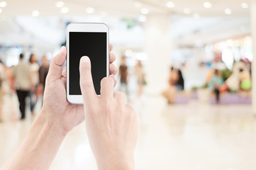 Blurred bokeh and people in shopping mall for background
