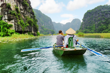 Fototapeta na wymiar Tourists in boat, Vietnam.