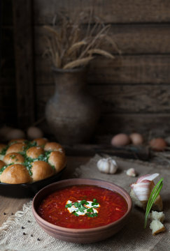 Traditional Ukrainian or Russian borscht with sour cream and garlic. Vegetarian vegetable food.