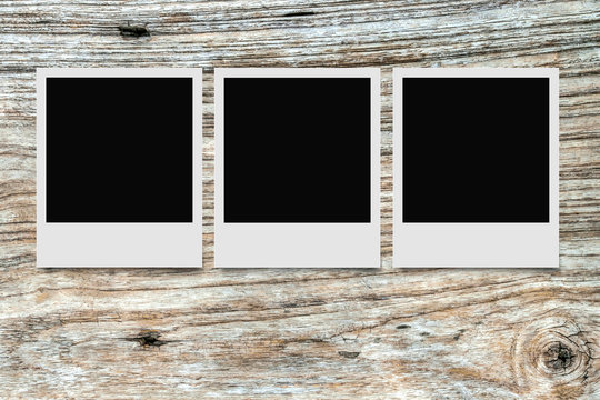 Blank photo on wooden background with clipping path