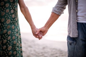 Senior couple holding hands